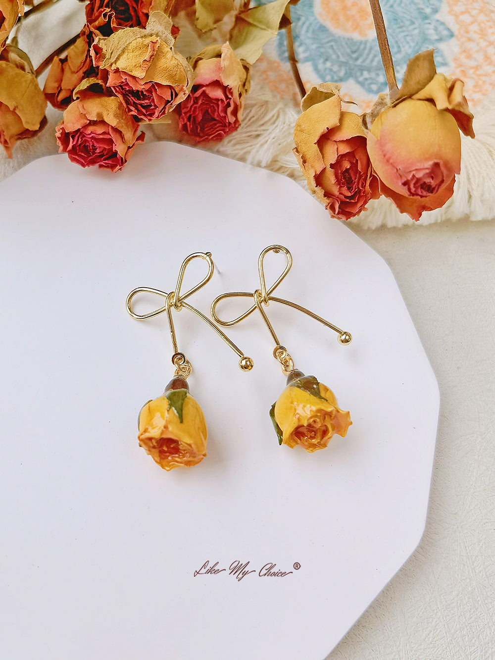Earrings with dried flowers and pink bow